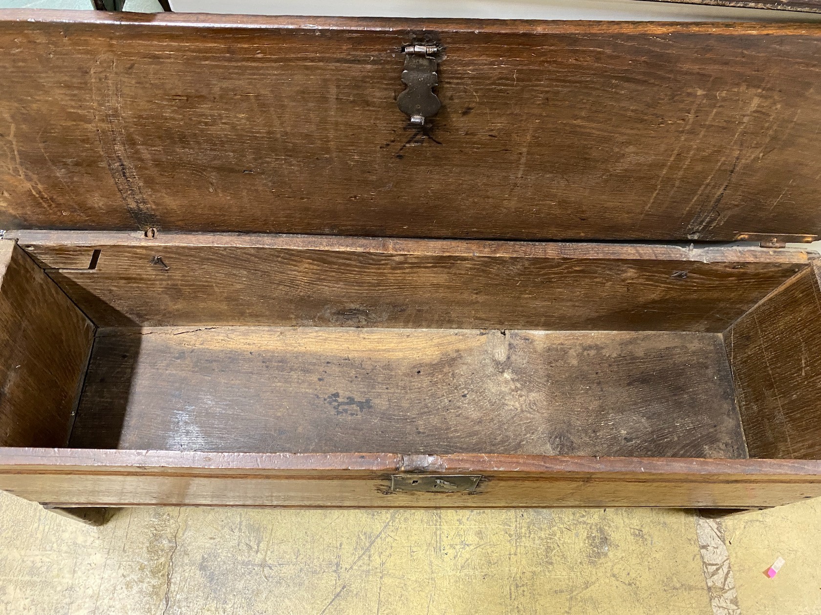 A 17th century oak six plank coffer, length 112cm, depth 32cm, height 48cm